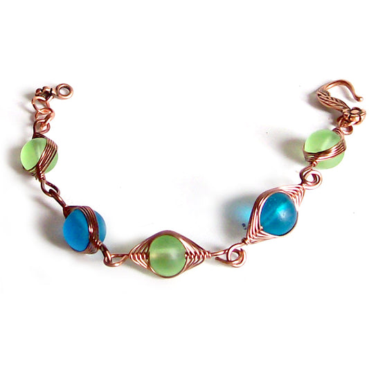 Artisan bracelet antiqued copper cultured SEA GLASS wire-wrapped . 10mm round beads & hook clasp - green & blue