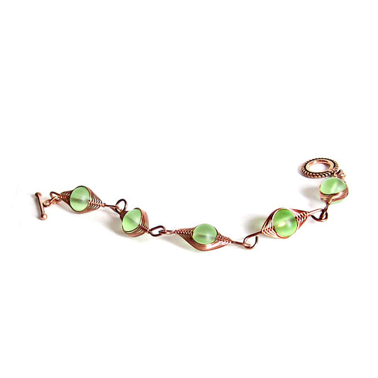 Artisan bracelet antiqued copper cultured SEA GLASS wire-wrapped . 10mm round beads & toggle clasp - green