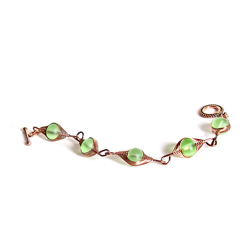 Artisan bracelet antiqued copper cultured SEA GLASS wire-wrapped . 10mm round beads & toggle clasp - green