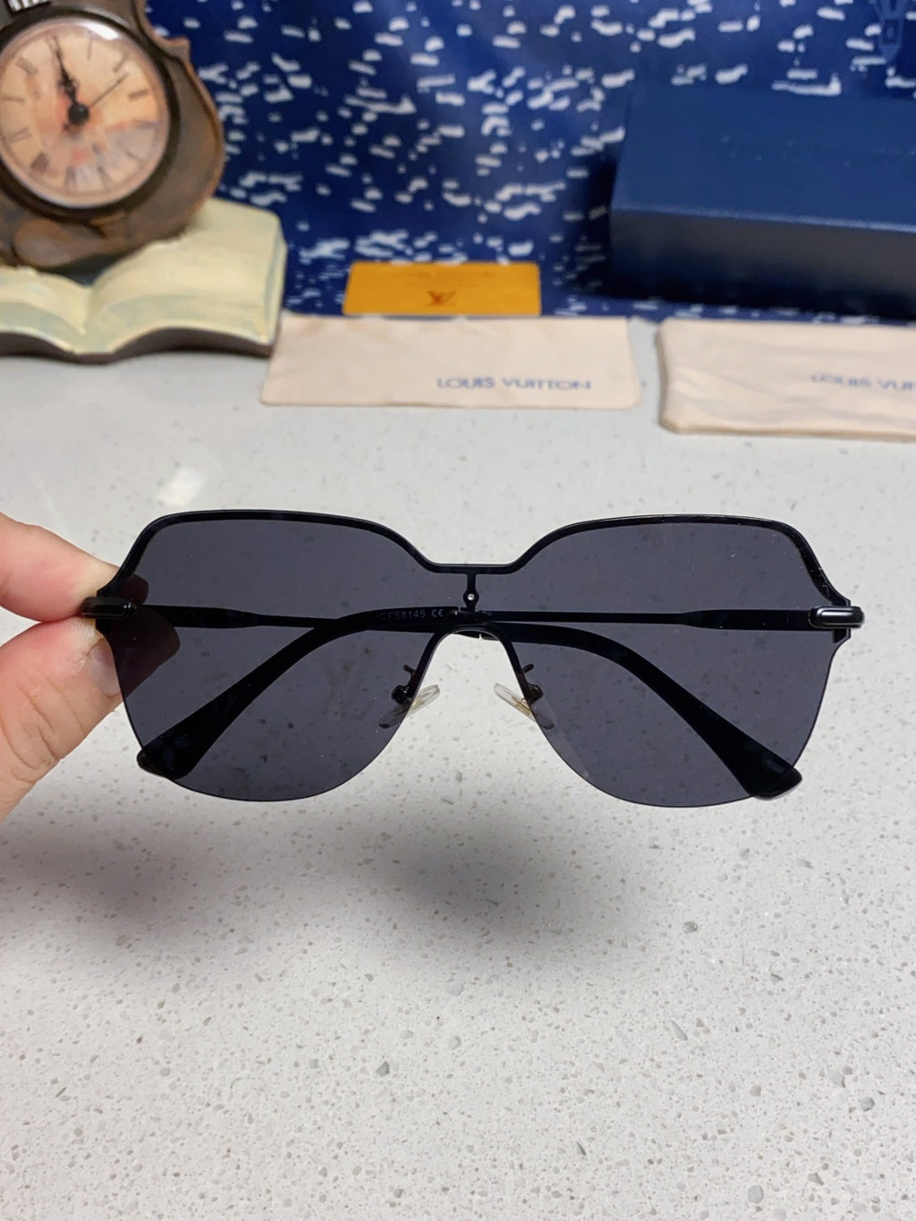 Louis Vuitton Lightweight Rimless Blue Lens Sunglasses for Women - detail image 4