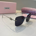 Miu Miu Lightweight Rimless Silver Lens Sunglasses for Women - 372414