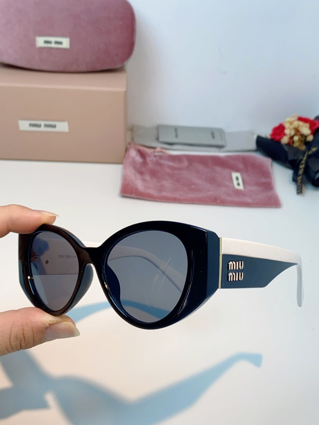 Miu Miu Polarized Cat-Eye Blue Lens Sunglasses for Men & Women - detail image 6