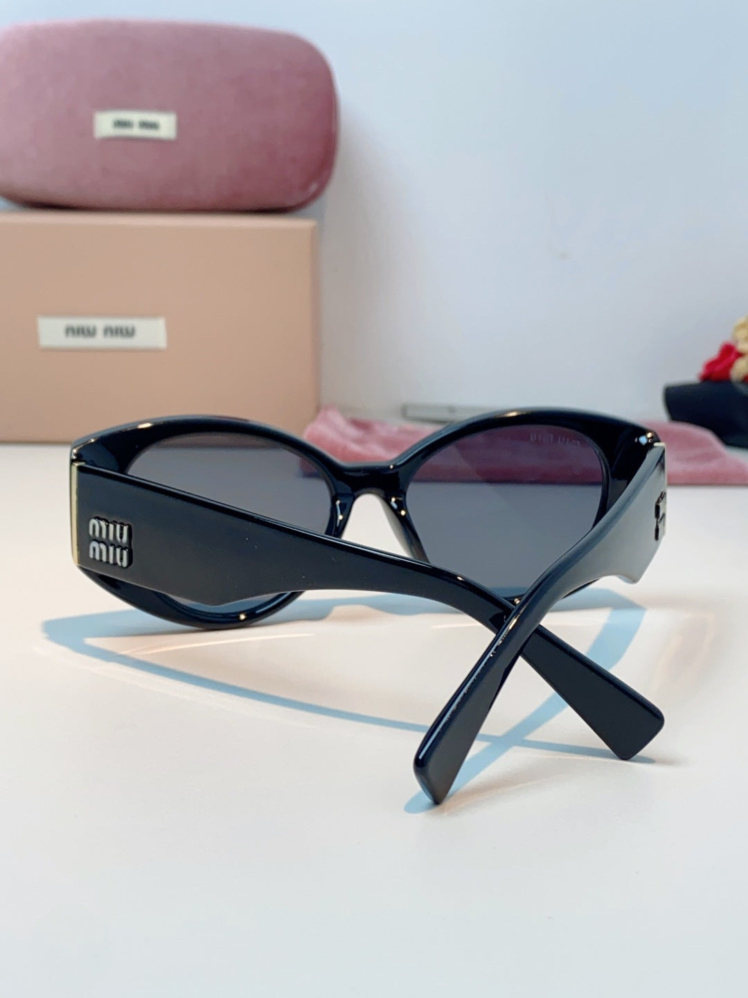 Miu Miu Polarized Cat-Eye Black Lens Sunglasses for Men & Women - detail image 3