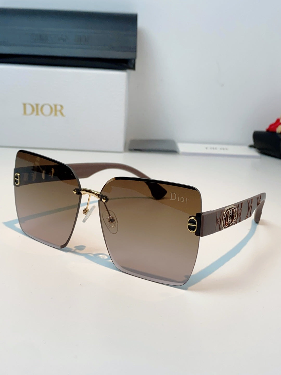 Dior Lightweight Rimless Brown Lens Sunglasses for Men & Women