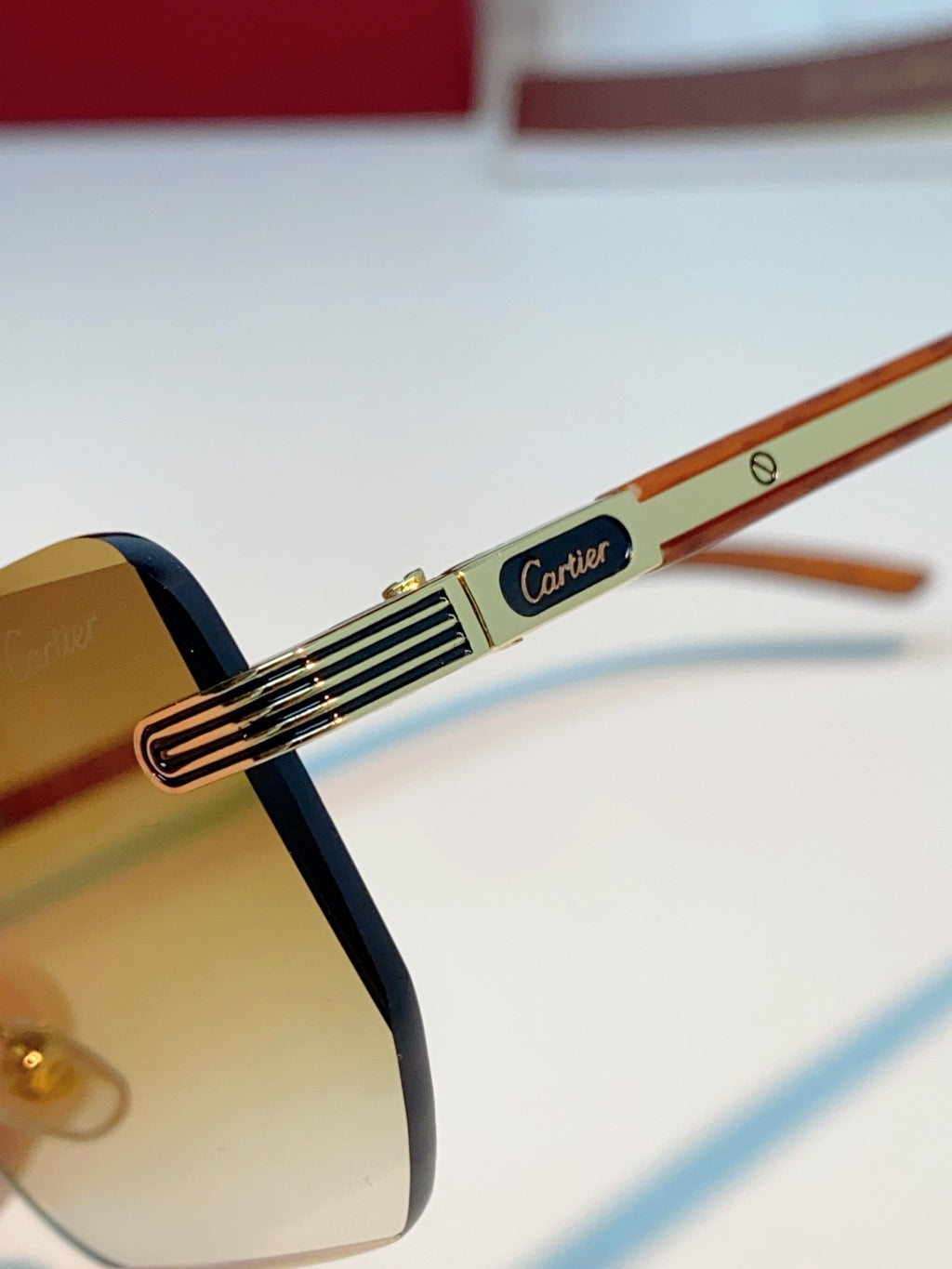 Cartier Lightweight Metal Rimless Orange Lens Sunglasses for Men & Women - detail image 8