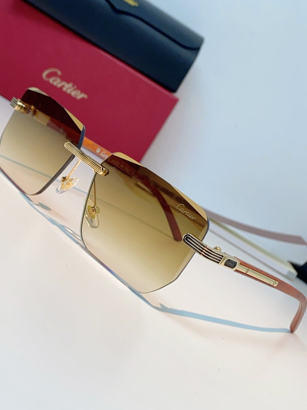 Cartier Lightweight Metal Rimless Orange Lens Sunglasses for Men & Women - detail image 7